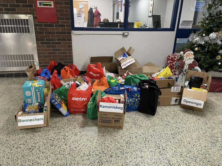 Flatbed carts of food and cash for Madawaska Valley Food Bank